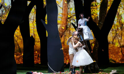 Cupid (Jack Missett) embraces Friodiligi (soprano Sarah Tucjer) while Despina (soprano Alisa Jordheim) looks on from above in San Diego Opera's COSI FAN TUTTE. Photo by Karli Cadel.